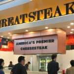Customers at a Great Steak cheesesteak franchise location in a mall