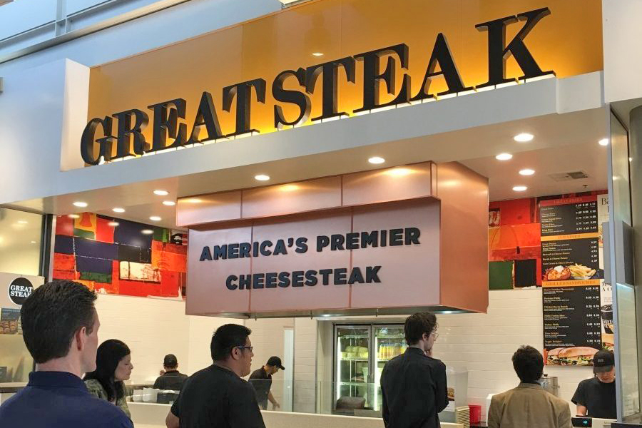 Customers at a Great Steak cheesesteak franchise location in a mall